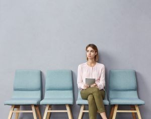 Portrait,Of,Confident,Serious,Young,European,Female,Sitting,On,Chair